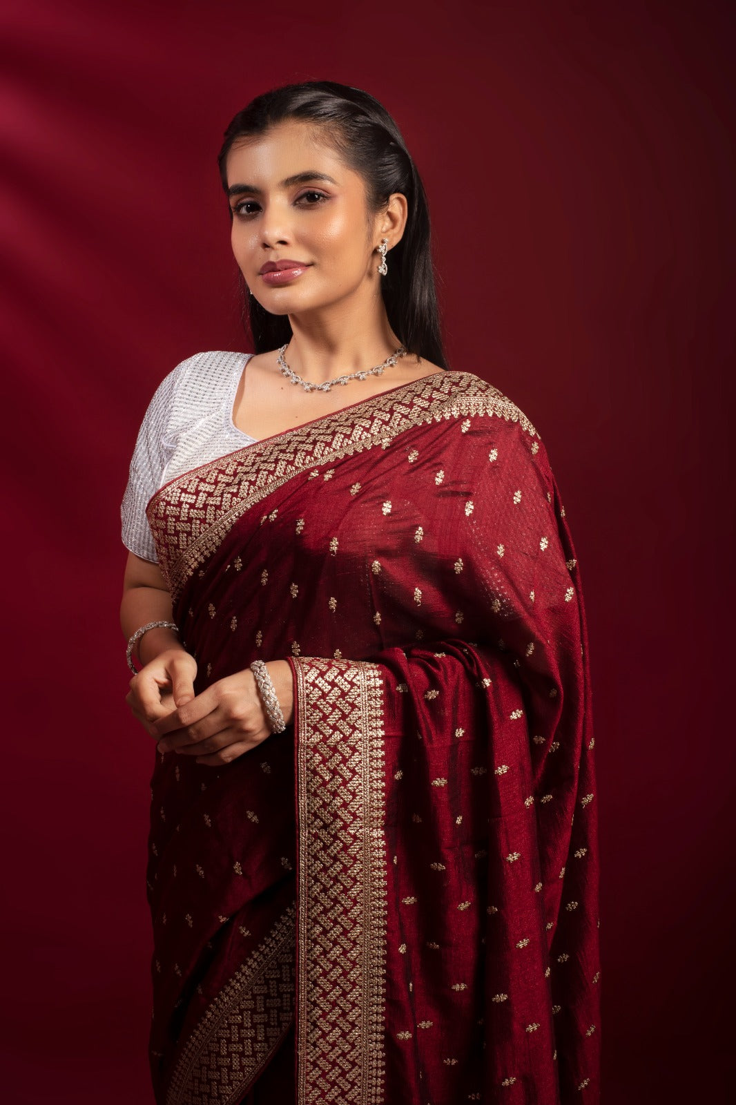 Maroon khaddi georgette saree with gold zari border and buti work – Geetanjali Plaza